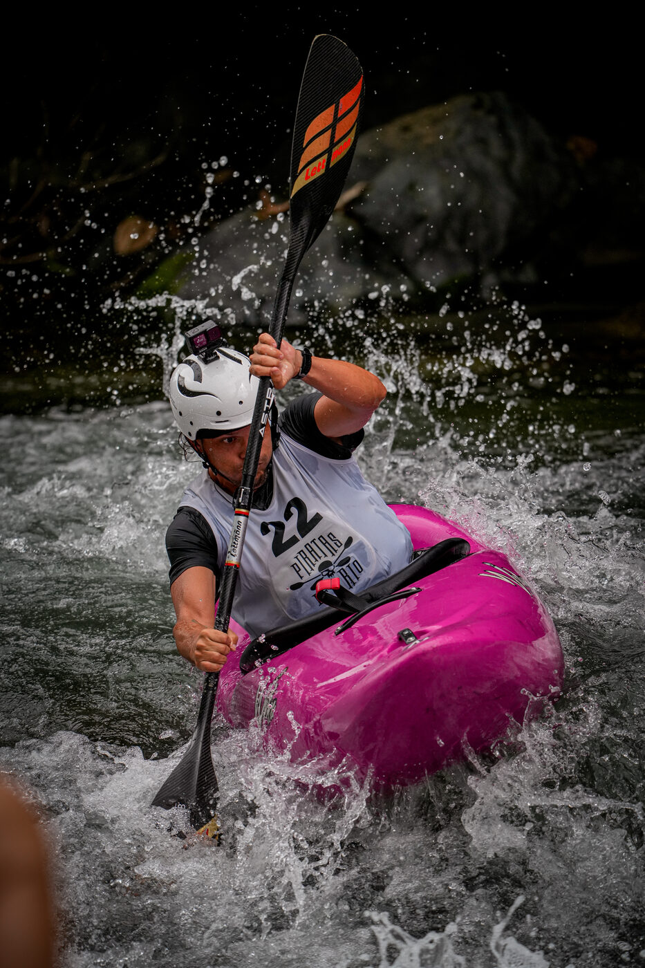 Diego racing his pink kayak through whitewater
