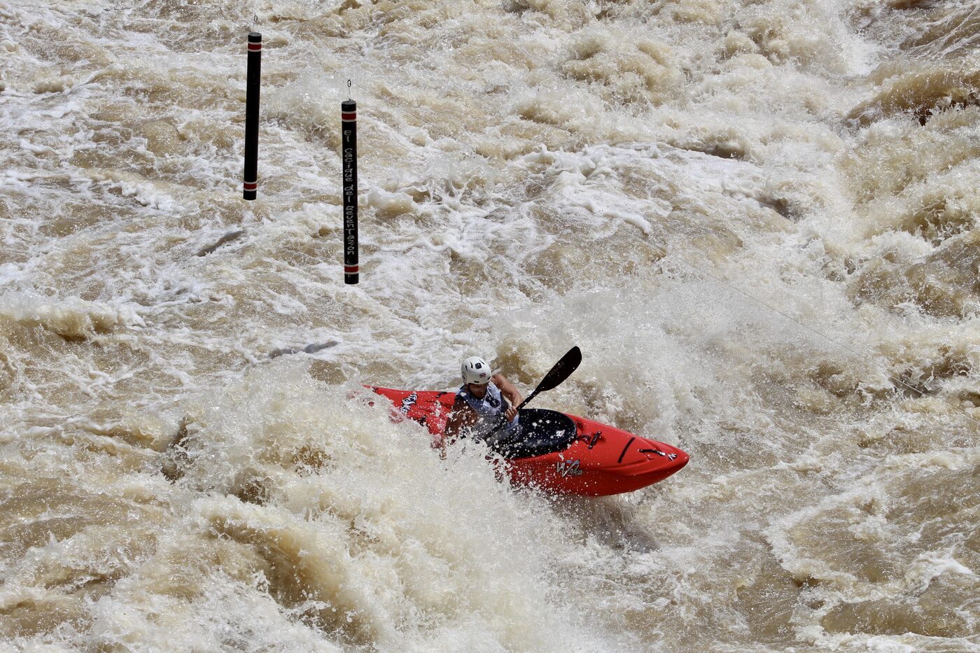 Diego punching through a big whitewater wave